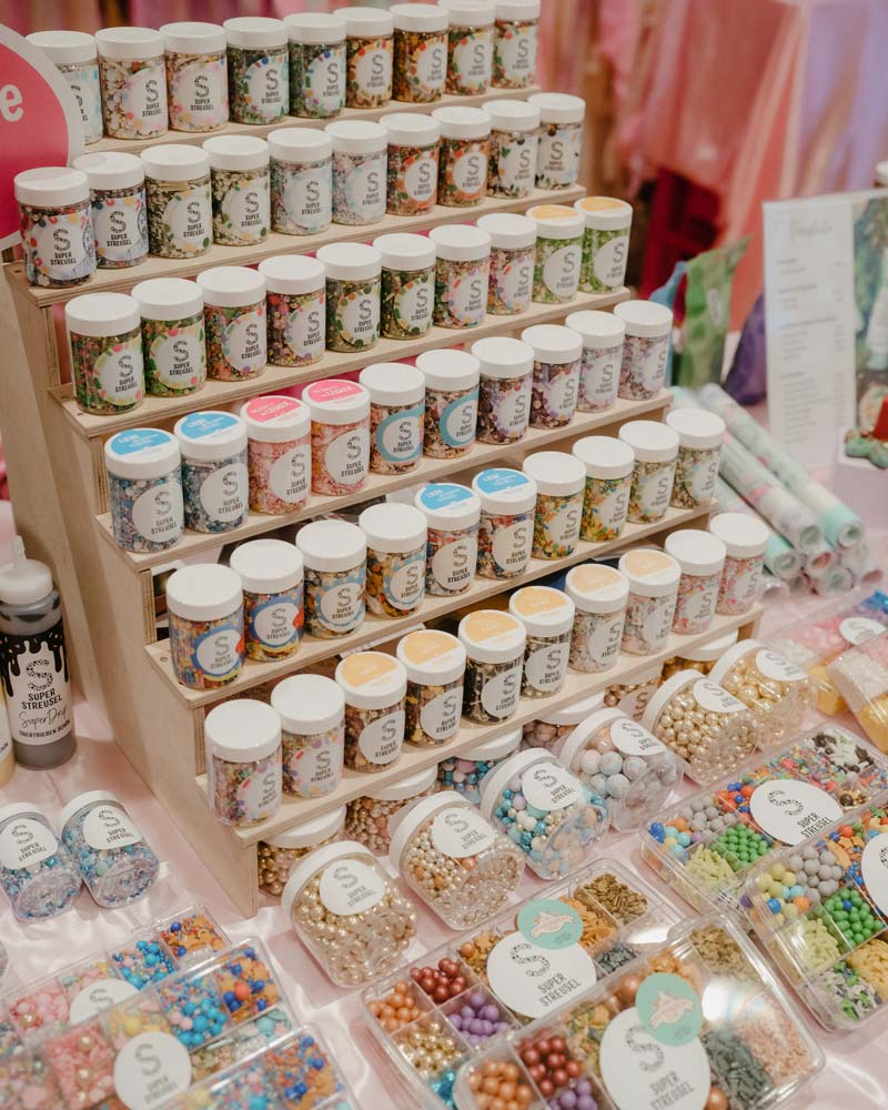 Tiered display of Super Streusel sprinkle jars