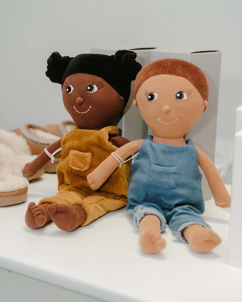 Handmade dolls presented on a shelf