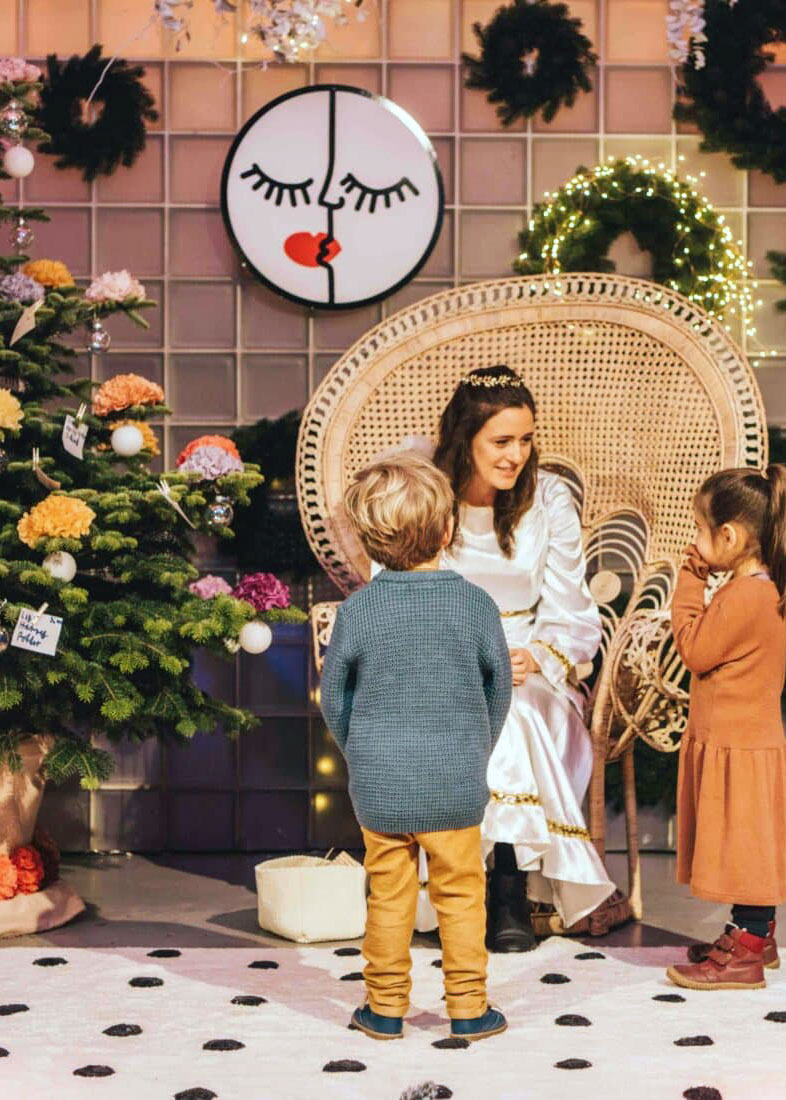 Storytelling moment with children at the decorated stage