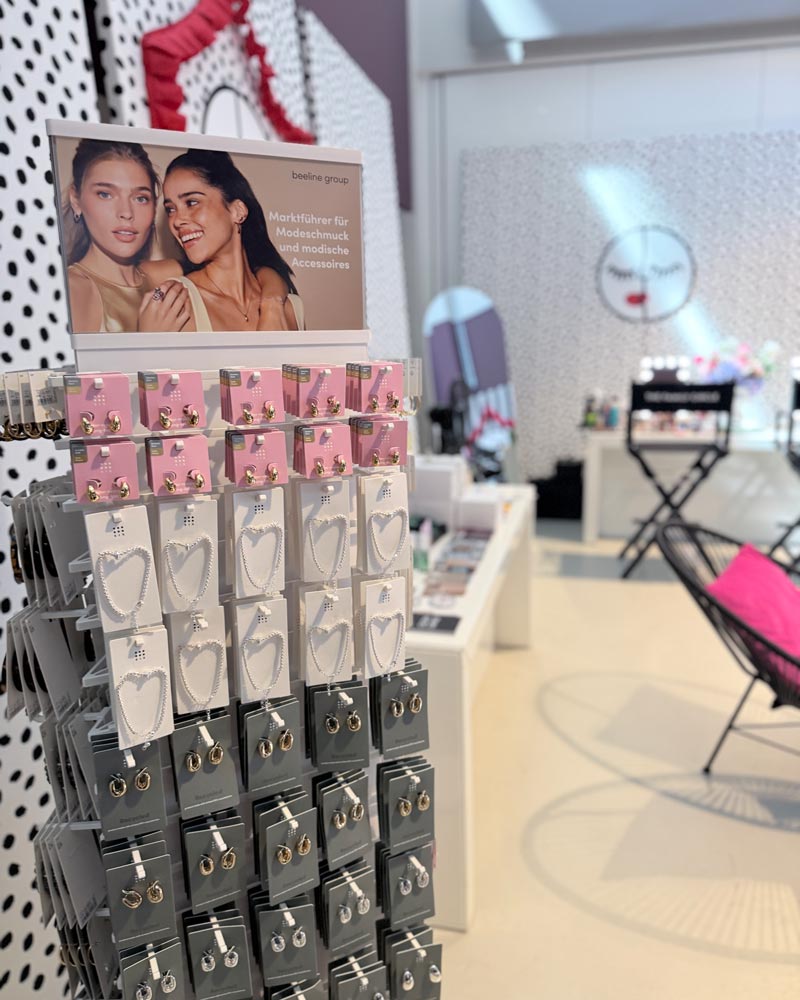 Vanity table with skincare and haircare products including ONNI haircare